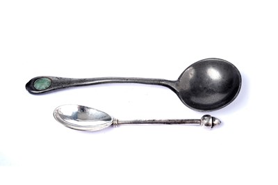 Lot 1555 - An Elizabeth II Scottish silver spoon and an art nouveau pewter spoon