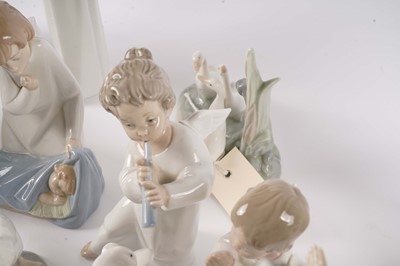 Lot 254 - A collection Lladro and Nao figures