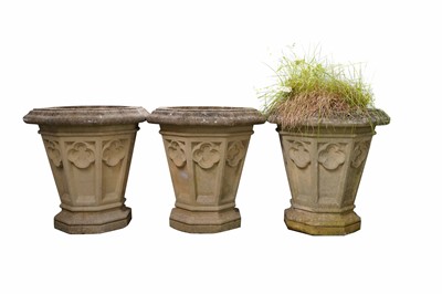 Lot 396 - A decorative trio of octagonal stone composite planters