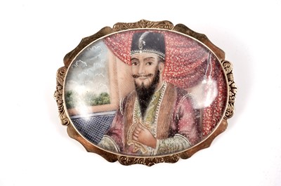 Lot 1218 - A 19th Century Indo-Persian miniature portrait brooch