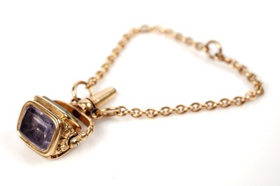 Lot 1219 - A 19th Century swivel watch key pendant