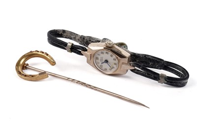 Lot 408 - A Lanco 9ct gold cased cocktail wristwatch; and a tie pin