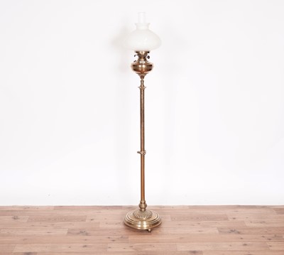 Lot 29 - An early 20th Century floor standing brass oil lamp