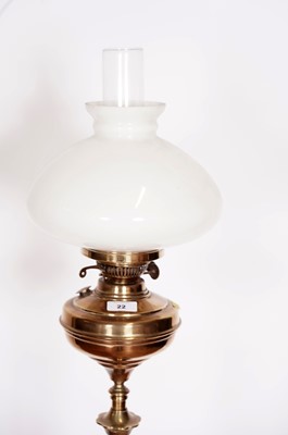Lot 29 - An early 20th Century floor standing brass oil lamp