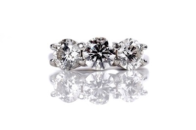 Lot 1243 - A three stone diamond ring