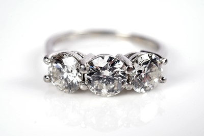 Lot 1243 - A three stone diamond ring