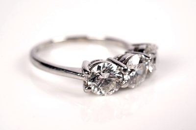 Lot 1243 - A three stone diamond ring