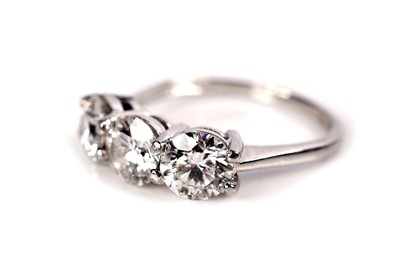 Lot 1243 - A three stone diamond ring