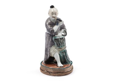 Lot 429 - A Chinese porcelain figure