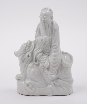 Lot 285 - A Chinese 'Blanc de Chine' figure; and a blue and white stem cup