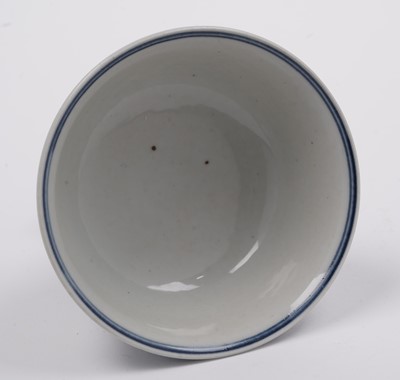 Lot 285 - A Chinese 'Blanc de Chine' figure; and a blue and white stem cup