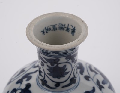 Lot 285 - A Chinese 'Blanc de Chine' figure; and a blue and white stem cup
