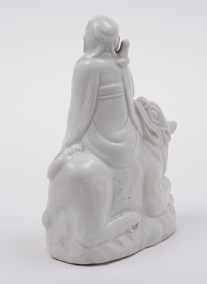 Lot 285 - A Chinese 'Blanc de Chine' figure; and a blue and white stem cup