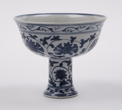 Lot 285 - A Chinese 'Blanc de Chine' figure; and a blue and white stem cup