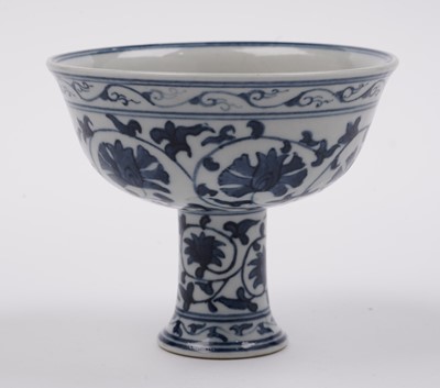 Lot 285 - A Chinese 'Blanc de Chine' figure; and a blue and white stem cup