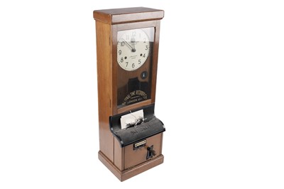 Lot 352 - A clocking in and out machine by the National Time Recorders Co Ltd