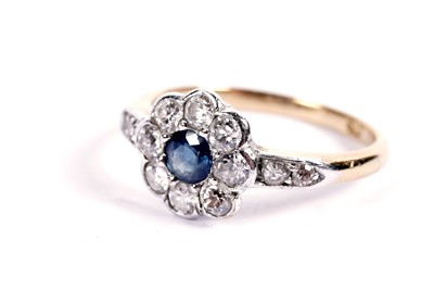 Lot 551 - A sapphire and diamond flower pattern ring