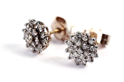 Lot 542 - A pair of diamond cluster earrings