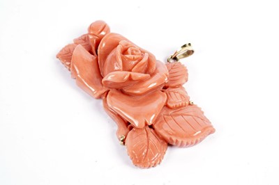 Lot 85 - A carved coral pendant in the form of a rose bloom