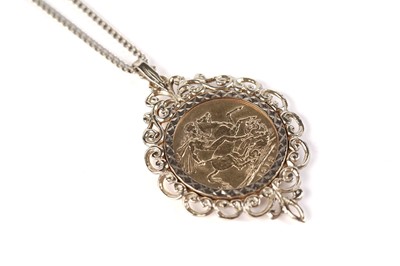 Lot 564 - A George V 1912 gold sovereign in a 9ct gold pendant setting