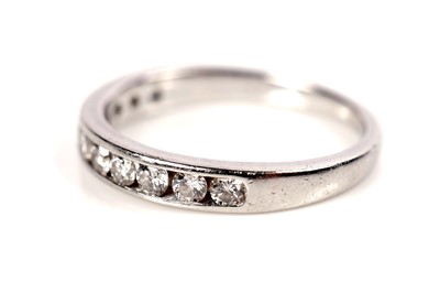 Lot 148 - A diamond half hoop eternity ring