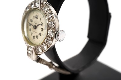 Lot 1003 - A diamond set platinum cased lady's cocktail watch