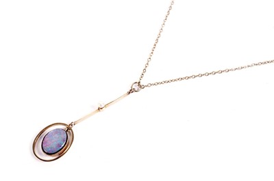 Lot 401 - An opal doublet and seed pearl drop pendant