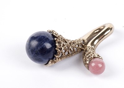 Lot 636 - A rose quartz and lapis lazuli pendant