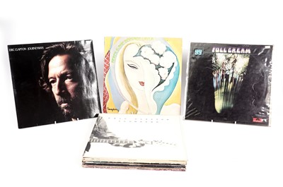 Lot 562 - Eric Clapton and associated LPs and 12" singles