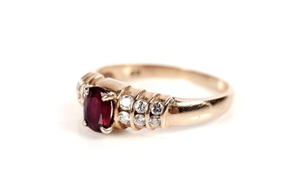 Lot 1086 - A ruby and diamond ring