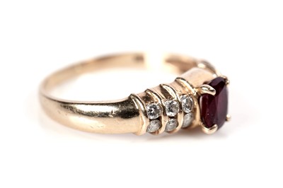 Lot 1086 - A ruby and diamond ring