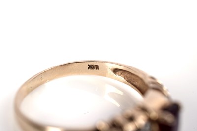 Lot 1086 - A ruby and diamond ring