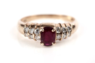 Lot 1086 - A ruby and diamond ring