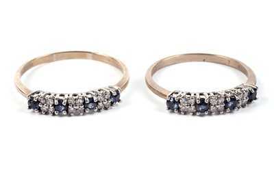 Lot 624 - Two sapphire and diamond half hoop eternity rings