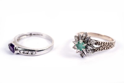 Lot 584 - An emerald and diamond star pattern ring; and an amethyst ring