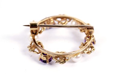 Lot 583 - An amethyst and pearl Celtic wreath brooch