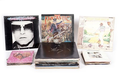 Lot 590 - A collectors' bundle of Elton John LPs, 12" singles and 7" singles