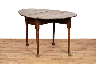 Lot 49 - A George III oak drop leaf table