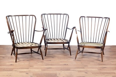 Lot 14 - Ercol: three Evergreen-style armchairs; and a coffee table