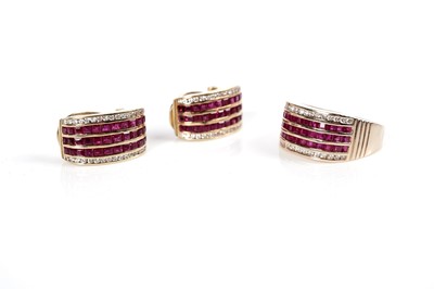 Lot 1253 - A ruby and diamond ring and matching earrings