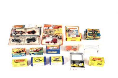 Lot 219 - A selection of carded Matchbox diecast vehicles; and a selection of ‘flat pack’ boxes