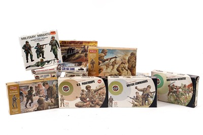 Lot 112 - A collection of Airfix model kits; and a selection of  Airfix 32nd scale Military figures