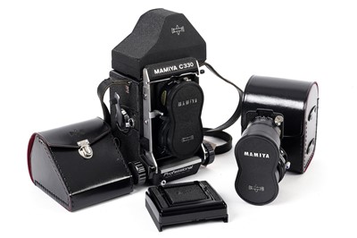 Lot 348 - A Mamiya C330 Professional TLR camera; and prism finder