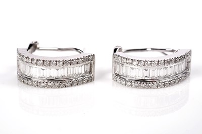 Lot 1257 - A pair of diamond hoop earrings