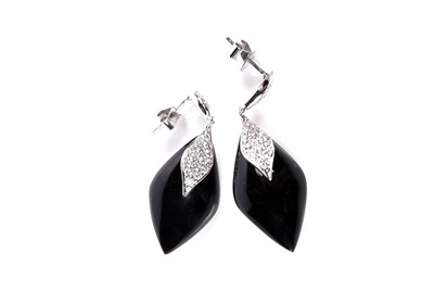 Lot 1258 - A pair of diamond and black onyx earrings