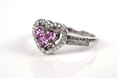 Lot 1259 - A pink sapphire and diamond ring and matching earrings