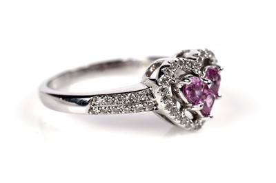 Lot 1259 - A pink sapphire and diamond ring and matching earrings