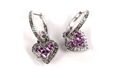 Lot 1259 - A pink sapphire and diamond ring and matching earrings