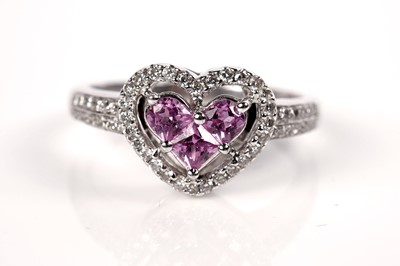 Lot 1259 - A pink sapphire and diamond ring and matching earrings