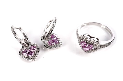 Lot 1259 - A pink sapphire and diamond ring and matching earrings